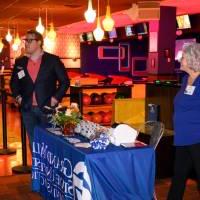 Director of Alumni Relations Susan Proctor talking to two alumni.